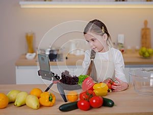 Young Girl Vlogger Making Social Media Video About Cooking For Internet At Home