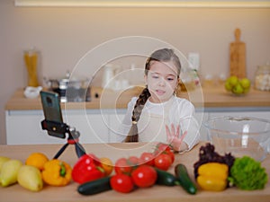 Young Girl Vlogger Making Social Media Video About Cooking For Internet At Home