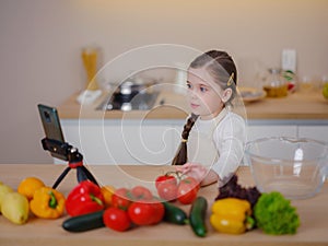 Young Girl Vlogger Making Social Media Video About Cooking For Internet At Home