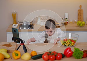 Young Girl Vlogger Making Social Media Video About Cooking For Internet At Home