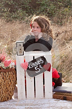 Young girl waiting at kissing stand