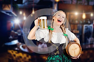 Young girl waitress oktoberfest in national costume with a mug o