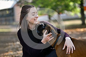 Young girl walking with her pet dog