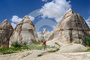 Young girl walking in Love Valley of Cappadocia.