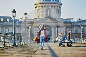 Young girl walking in Paris on a sunny fall day
