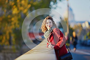 Young girl walking in Paris on a sunny fall day