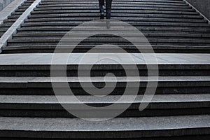 Young girl walking up the stairs.  Underground pass.