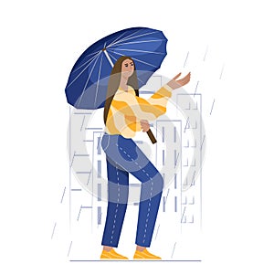 A young girl walks through the city on a rainy day with an umbrella. The concept of the weather and the long-awaited rain