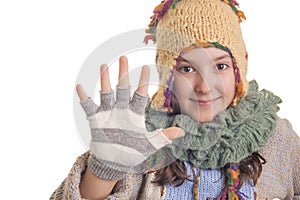 Young girl in warm winter clothes showing five
