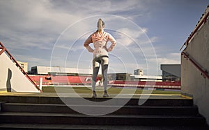 A young girl is warming-up for a training at the stadium. Sport, athletics, athletes