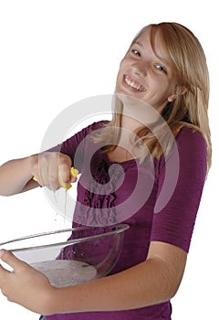 Young girl washing dish's holding bowl and sponge
