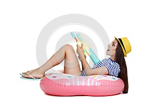 Young girl with water gun