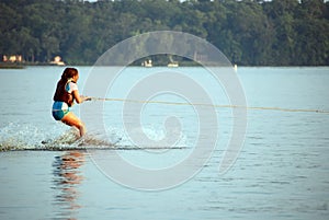 Young girl water skiing