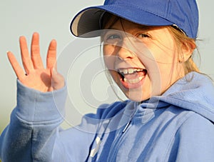 Young girl waving