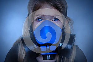 Young girl wearing gasmask, respirator portrait