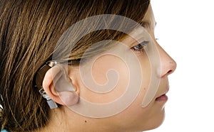 Young girl wearing a hearing aid