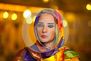 Young girl wearing hijab against bokeh lights