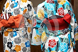 Young girl wearing Japanese kimono standing in front of Sensoji