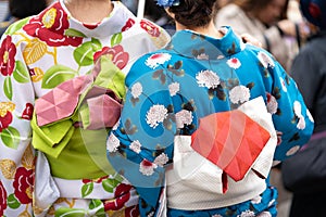 Young girl wearing Japanese kimono standing in front of Sensoji