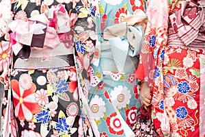 Young girl wearing Japanese kimono standing in front of Sensoji Temple in Tokyo, Japan. Kimono is a Japanese traditional garment.