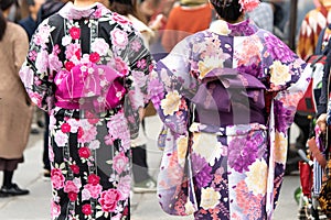 Young girl wearing Japanese kimono standing in front of Sensoji Temple in Tokyo, Japan. Kimono is a Japanese traditional garment.