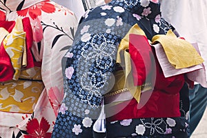 Young girl wearing Japanese kimono standing in front of Sensoji Temple in Tokyo, Japan. Kimono is a Japanese traditional garment.