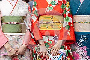 Young girl wearing Japanese kimono standing in front of Sensoji Temple in Tokyo, Japan. Kimono is a Japanese traditional garment.
