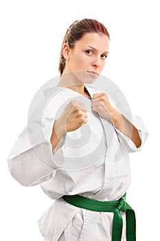 Young girl wearing kimono and holding her fists up