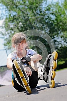 Young girl wearing rollerblades