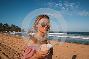 Young girl wearing sunglasses walking down