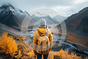 Young girl wearing a vibrant yellow jacket, arriving at the end of the hike, representing the spirit of adventure, accomplishment