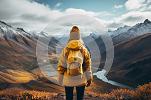 Young girl wearing a vibrant yellow jacket, arriving at the end of the hike, representing the spirit of adventure, accomplishment