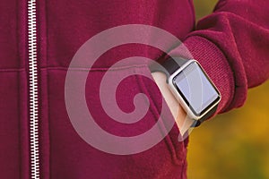 Girl wearing smart-watch on her hand photo