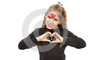 The young girl on a white background had her hands in the form of a heart on a white background. She smiles
