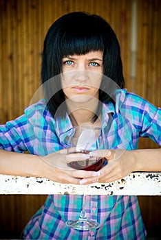 The young girl with a wine glass