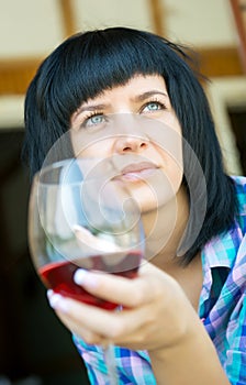 The young girl with a wine glass