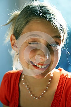 Young girl winking