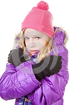 Young girl in winter outfit heaving cold over white background