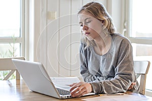 Young girl working on a laptop