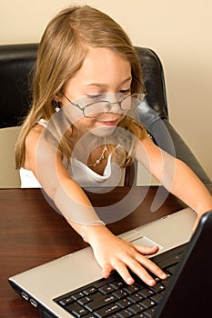 Young girl working at a notebook PC