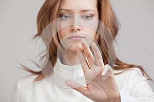 Young girl working with virtual screen