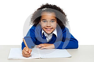 Young girl writing copying notes