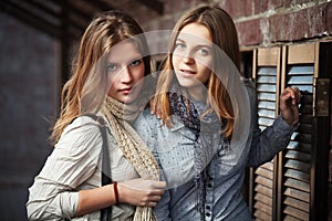 Young girls against a wall