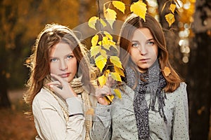 Young girls in autumn park