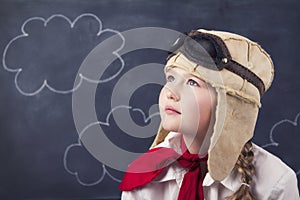 Young girls with aviator goggles and hat photo