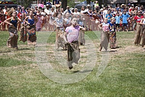 Young girls compete in Three Legged race