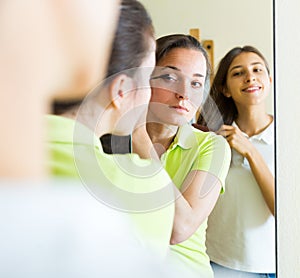 Young girls doing make-up for party