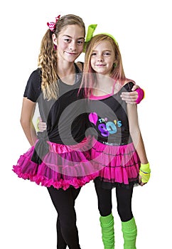 Young girls dressed in retro 80s clothing isolated on a white background