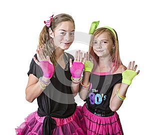 Young girls dressed in retro 80s clothing isolated on a white background