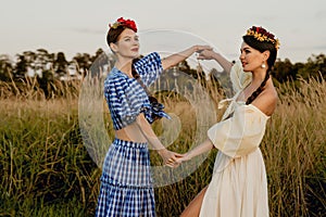 Young girls dressed in white and blue dress